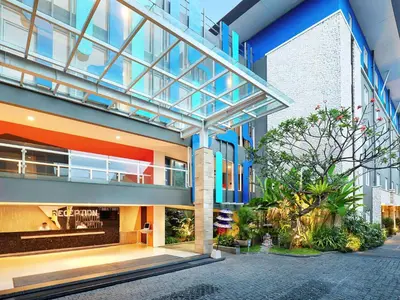 a large building with a walkway in front of it at Primera Hotel Seminyak in Seminyak