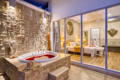 a bathroom with a large tub in a room at Bali Cosy Villas Seminyak in Legian
