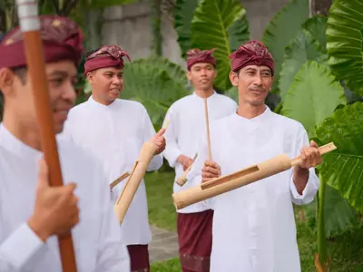a group of men holding wooden baseball bats at The One Boutique Villa & Spa Seminyak in Seminyak