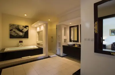 a large bathroom with a tub and a sink at The Yubi Boutique Villas Seminyak in Seminyak