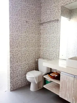 a bathroom with a white toilet and a sink at ★ VIP ★ Green Studio Apartment in Seminyak, No.23 in Seminyak