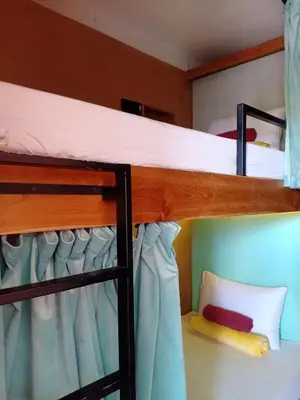a bunk bed in a room with a bunk bed in a room at Stellar Capsules in Seminyak