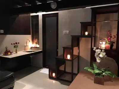 a kitchen with a sink and a counter with candles at Bali Elephants Boutique Villa in Jimbaran