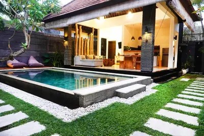 a swimming pool in the yard of a villa at Villa Marick in Seminyak