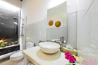 a bathroom with a bowl sink on a counter at Villa Marick in Seminyak