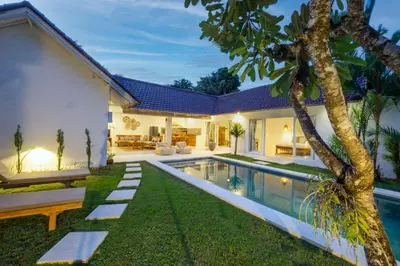an image of a backyard with a swimming pool and a house at Villa Pagu in Seminyak