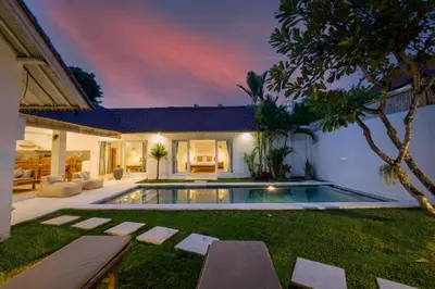 an image of a backyard with a swimming pool and a house at Villa Pagu in Seminyak