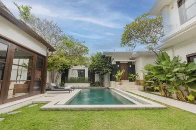 a swimming pool in the backyard of a house at Villa Harmony - Residence in Seminyak