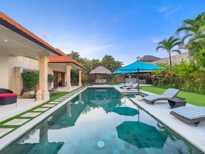 an image of a swimming pool in a villa at Villa Bugis Drupadi Seminyak in Seminyak