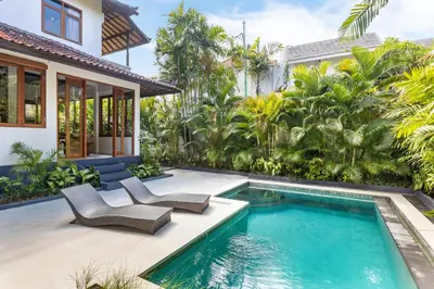 a swimming pool in the backyard of a villa at Unicorn Shelter Villa in Seminyak