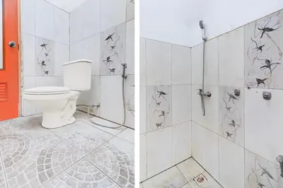 a bathroom with a toilet and a shower at Collection O Sanur Near Bali Exotic Marine Park in Sanur
