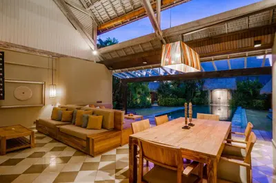 a living room with a table and a couch at Space Villas Bali in Seminyak