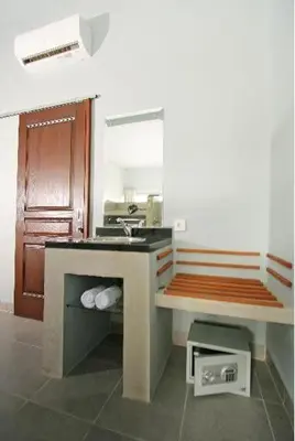a kitchen with a sink and a counter top at The Grey Boutique Inn in Legian