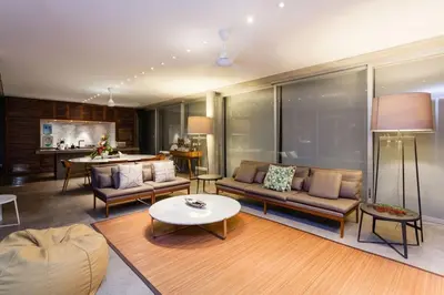 a living room with a couch and a table at Villa C88 Seminyak in Seminyak