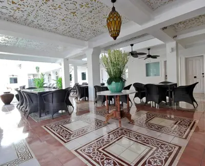 a dining room with a table and chairs at Samsara Inn in Legian
