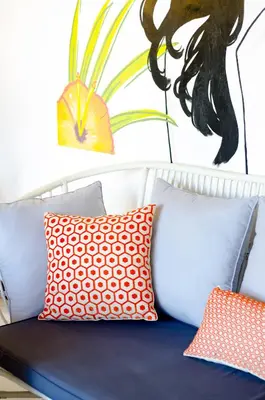 a group of pillows on a couch with a painting at Villa Salya - 3BR - Private Pool - 1min walk to La Favela! in Seminyak