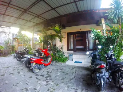 a group of motorcycles parked in front of a building at Leyeh Leyeh Homestay in Canggu