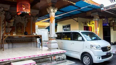 a white van parked in front of a building at Leyeh Leyeh Homestay in Canggu