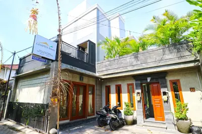 a motorcycle parked in front of a building at Gempita House Legian Bali in Legian