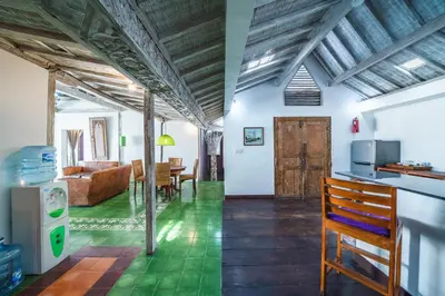 a kitchen and living room with a couch and a table at Villa West - Charming 2 bdr villa in Oberoi - PERFECT LOCATION! in Seminyak