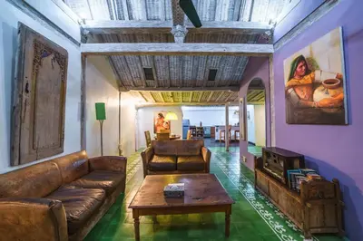 a living room with a couch and a table at Villa West - Charming 2 bdr villa in Oberoi - PERFECT LOCATION! in Seminyak