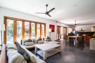 a living room with a couch and a table at Villa Martine - Fantastic 5BR Villa - Perfect Location in Seminyak in Seminyak
