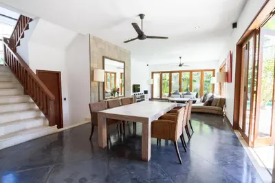 a dining room with a table and chairs at Villa Martine - Fantastic 5BR Villa - Perfect Location in Seminyak in Seminyak