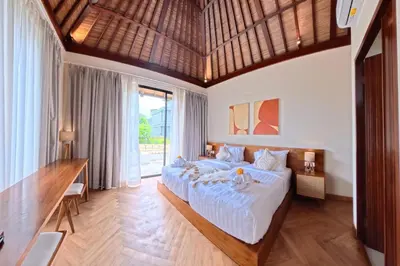 a bedroom with a large bed and a large window at NEW 2BR Minica Villa in the heart of Kayu Aya, Oberoi, Seminyak walking distance to Beach, Shops, Restaurants in Seminyak