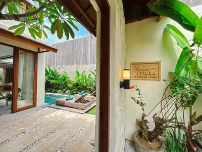 a door to a villa with a patio and a pool at NEW 2BR Minica Villa in the heart of Kayu Aya, Oberoi, Seminyak walking distance to Beach, Shops, Restaurants in Seminyak