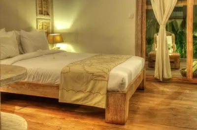 a bedroom with a large bed and a window at Villa Layla - Charming 2BR Villa in Oberoi - Prime Location! in Seminyak