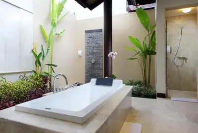 a bathroom with a sink and a shower with plants at RC Villas and Spa Bali in Seminyak