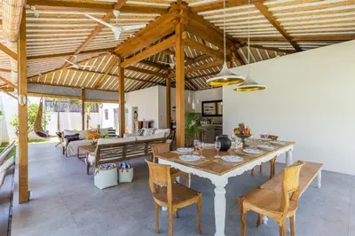 a dining room with a table and chairs at Villa soul in Seminyak