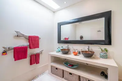 a bathroom with two sinks and a mirror at Villa Sawah - 3bd in Seminyak Center in Seminyak