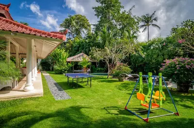 a backyard with a ping pong table at Villa Sipo in Seminyak