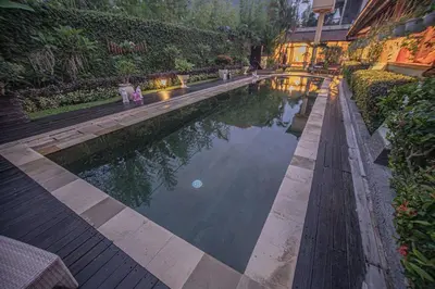 a swimming pool in the middle of a building at Sasa Bali Villas in Seminyak