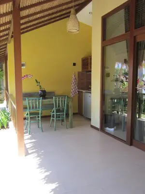 a kitchen and dining room with a table and chairs at Sasa Bali Villas in Seminyak
