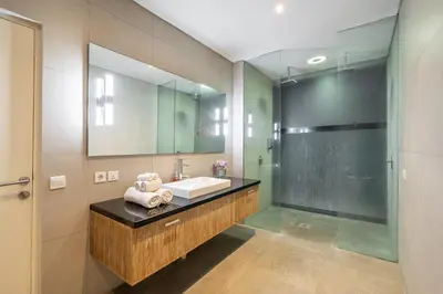 a bathroom with a sink and a mirror at Villa Jekumah 2 in Seminyak