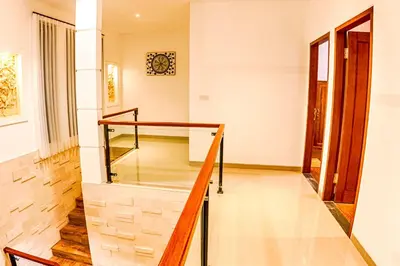 a glass staircase in a house at Villa Caitlyn, Seminyak - Modern 3 Bedroom Villa with Private Pool! in Seminyak