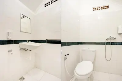 a bathroom with a toilet and a sink at Hotel O Ratu in Denpasar