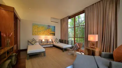 a living room with a couch and a table at Casa Brio in Seminyak