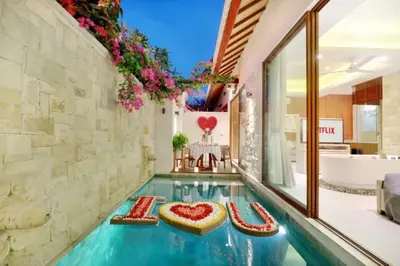 a swimming pool with a heart on the floor in a house at La Vie Villa Seminyak by Ini Vie Hospitality in Seminyak