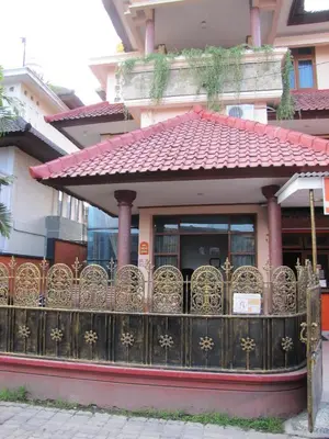 a gate in front of a building with a fence at Diva House in Denpasar