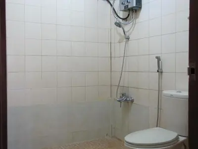 a bathroom with a shower with a toilet at Diva House in Denpasar