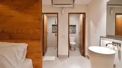 a bathroom with a sink and a toilet at DBeds Kuta Beach in Kuta