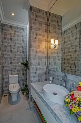 a bathroom with a white toilet and a sink at Villa Ley Double Six by Best Deals Asia Hospitality in Seminyak