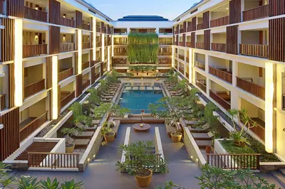 an overhead view of an apartment building with a pool at The Magani Hotel and Spa in Legian