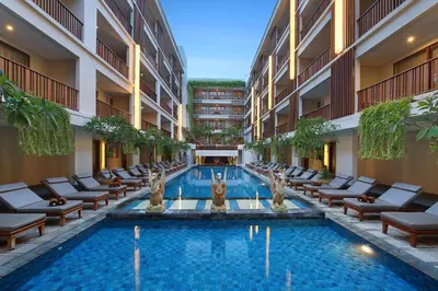 a swimming pool in the middle of a building at The Magani Hotel and Spa in Legian
