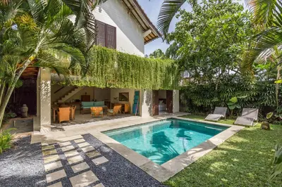 a pool in the backyard of a villa at Rumi Villas in Seminyak