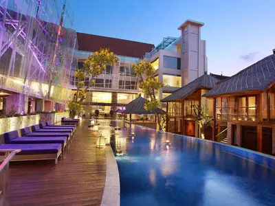 a large swimming pool in the middle of a building at Grand Mega Resort & Spa Bali in Kuta