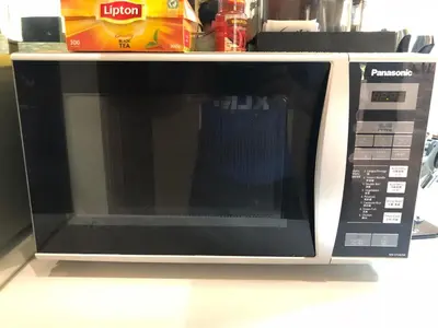 a microwave oven sitting on top of a counter at Villa Chambertin in Seminyak
